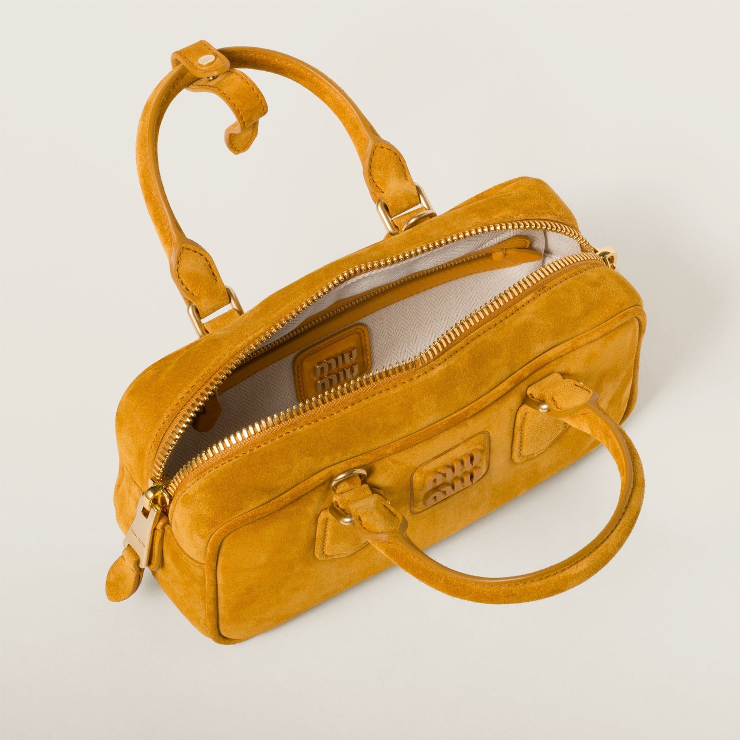 Arcadie padded suede top-handle bag