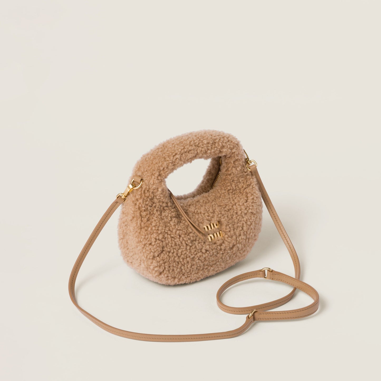 Wander shearling hobo bag with leather details